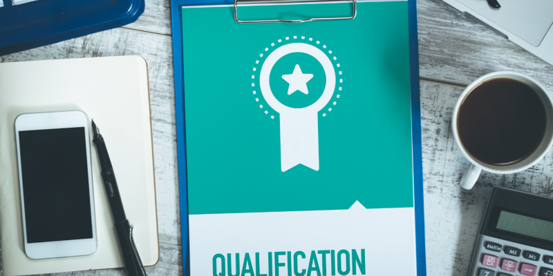 Clipboard showing qualification certificate representing accredited life coach training in the UK