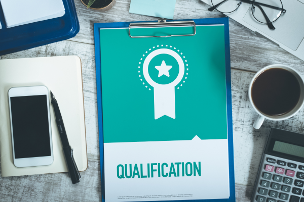 Clipboard showing qualification certificate representing accredited life coach training in the UK